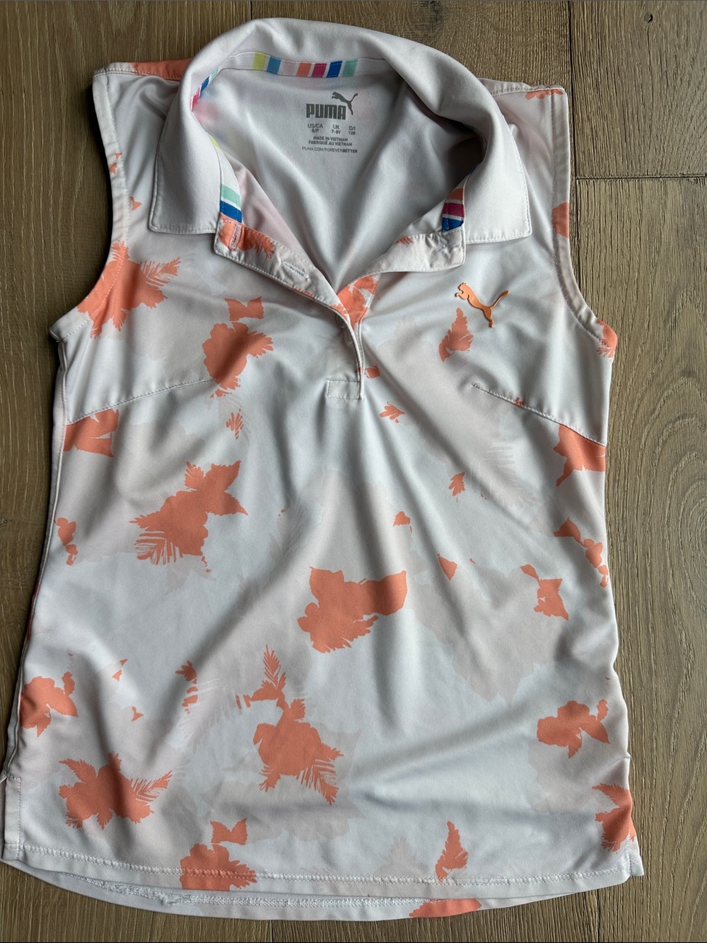Puma White Sleeveless Polo with Coral Floral Accents